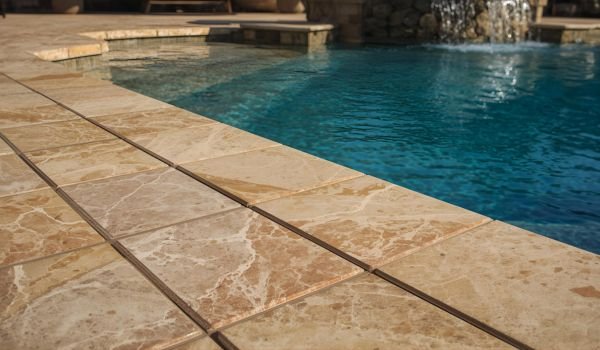 Why Choose Travertine Pavers for Your Pool Deck?